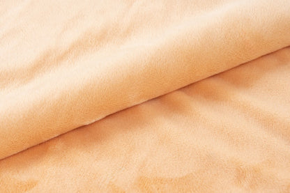Plush deken – Perzik met zachte ribbelstructuur
